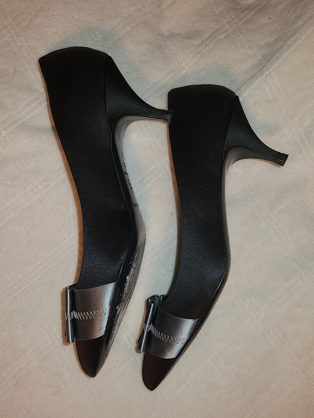 Women's Black Pointed Toe Kitten Heels with Metallic Bow Accent